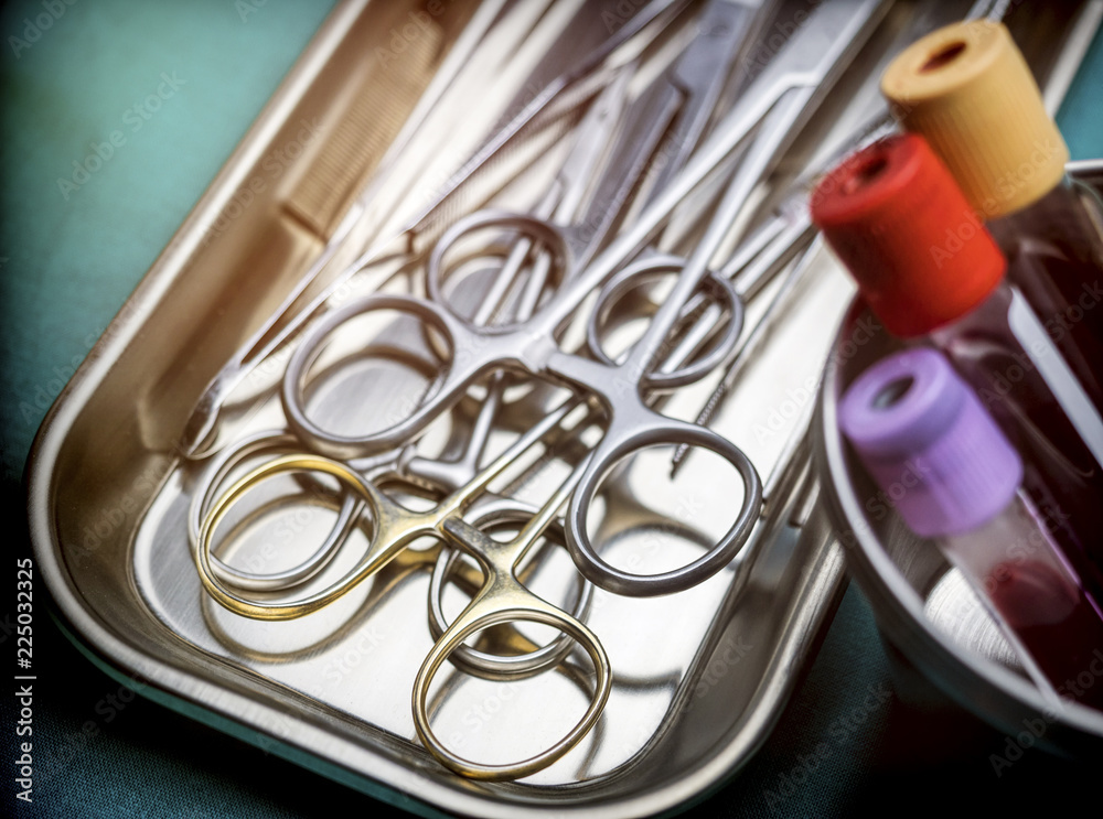 Some scissors for surgery on a tray in an operating theater, conceptual image Some scissors for surgery on a tray in an operating theater, conceptual image