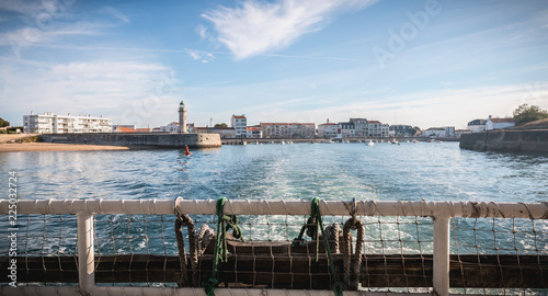 rear view of a ferry leaving the port photo