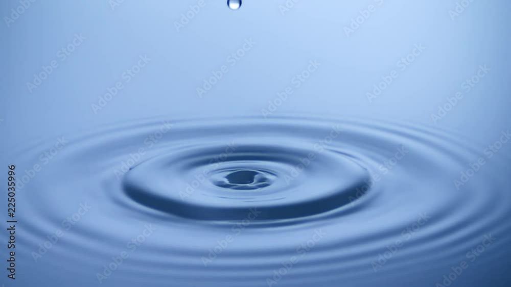 Slow Motion Water drop splash into calm water - shot with ultra high speed camera Slow Motion Water drop splash into calm water - shot with ultra high speed camera