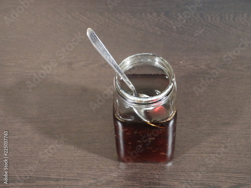 Honey, Honey in Glass Jar on Wooden Background, Honey Called Shahad in India,Honey photo