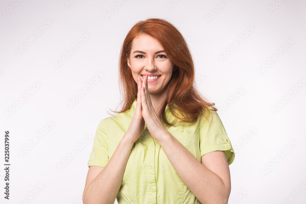 Beautiful young woman with red hair on white background Beautiful young woman with red hair on white background