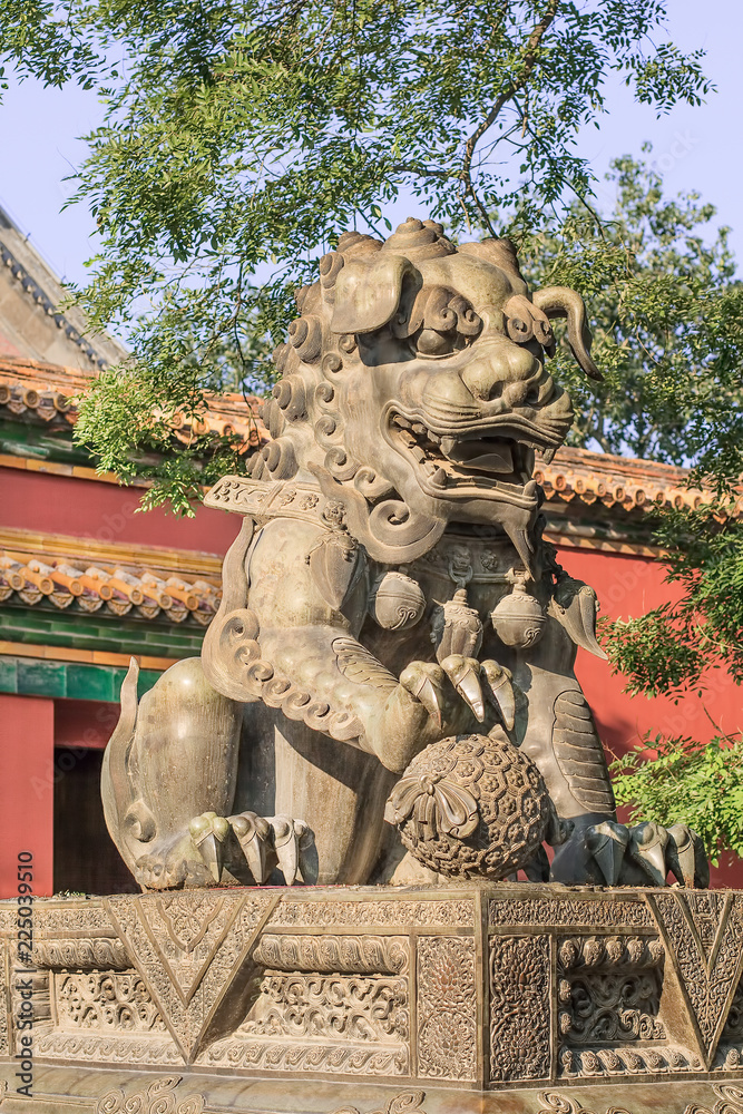 Guardian Lion in front of an ornamented pavilion at Yonghe Lamasery, also known as Lama Temple, monastery of the Gelug school of Tibetan Buddhism located in Dongcheng District.
