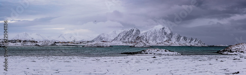 Landscape with beautiful winter sea and snowy mountains at Lofoten Islands in Northern Norway. Panoramic view