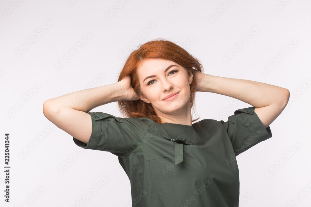 Young redhead woman posing on white background Young redhead woman posing on white background