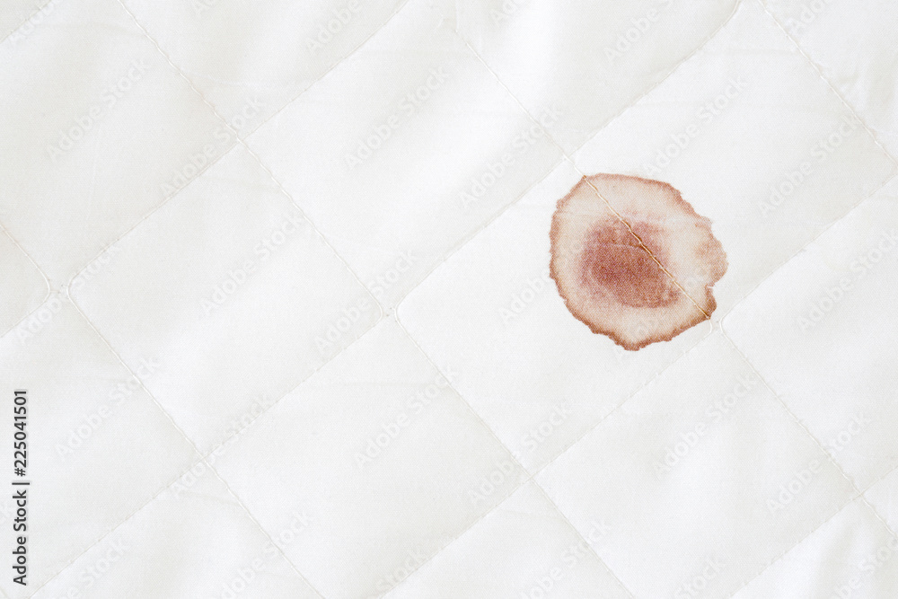 Blood stain on white mattress after night menstruation. Fresh or old stains  cleaning from sheet of bed. Empty place for text. Close up. Top view. Stock  Photo | Adobe Stock