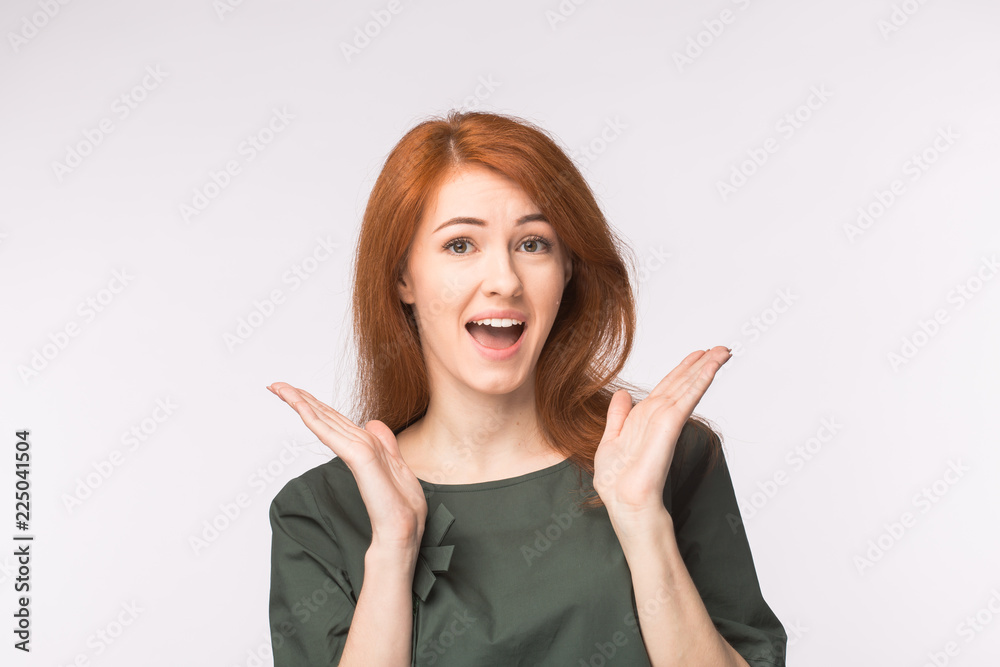 Surprised redhead young woman on white background Surprised redhead young woman on white background