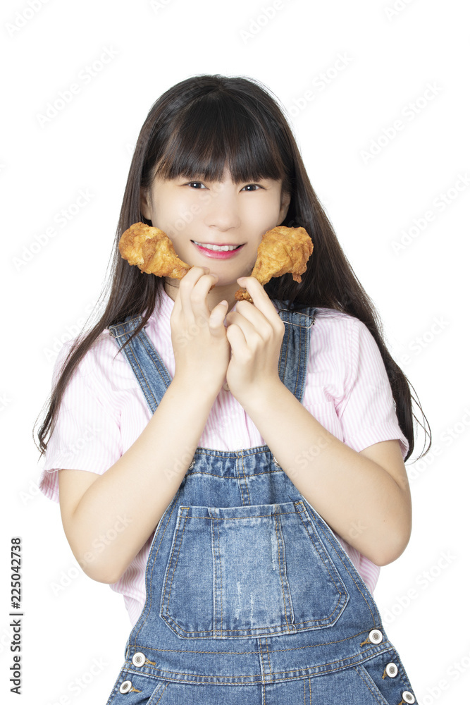 Chinese woman eating fried chicken drumstick isolated on white background