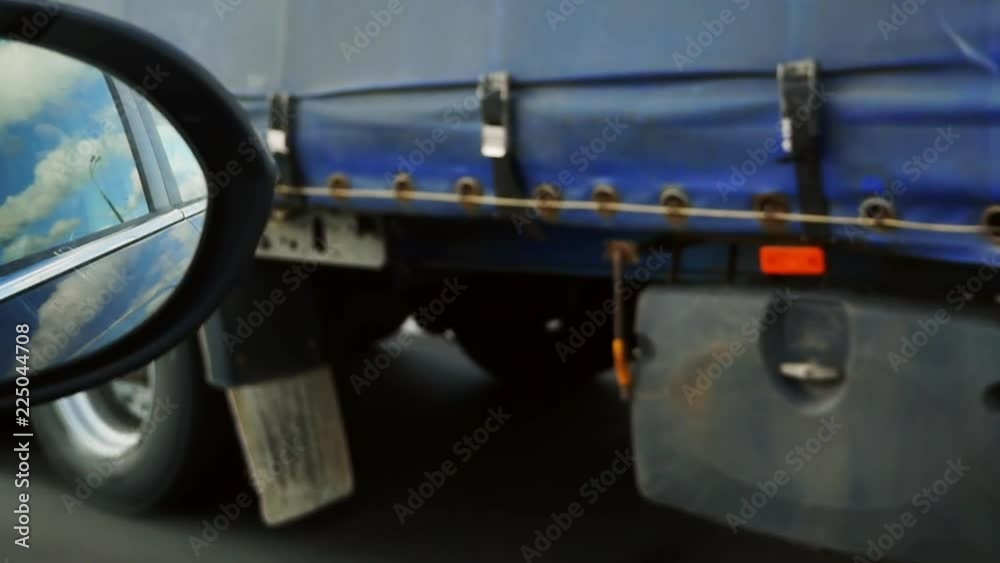 Close up of a truck's wheels driving on a road. truck driving on the road. machine wheels close up Close up of a truck's wheels driving on a road. truck driving on the road. machine wheels close up