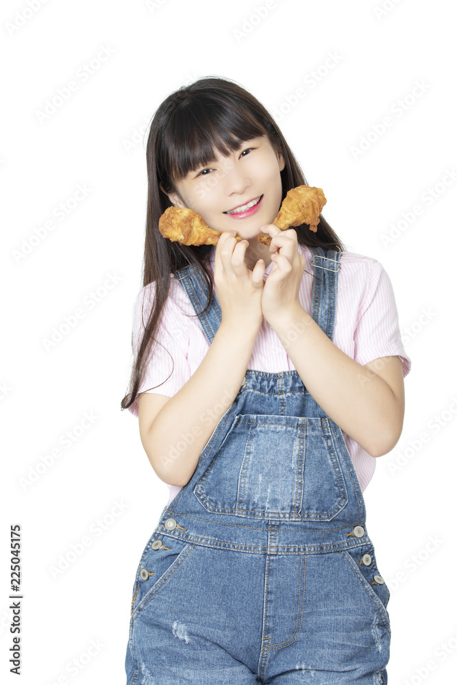 Chinese woman eating fried chicken drumstick isolated on white background Chinese woman eating fried chicken drumstick isolated on white background