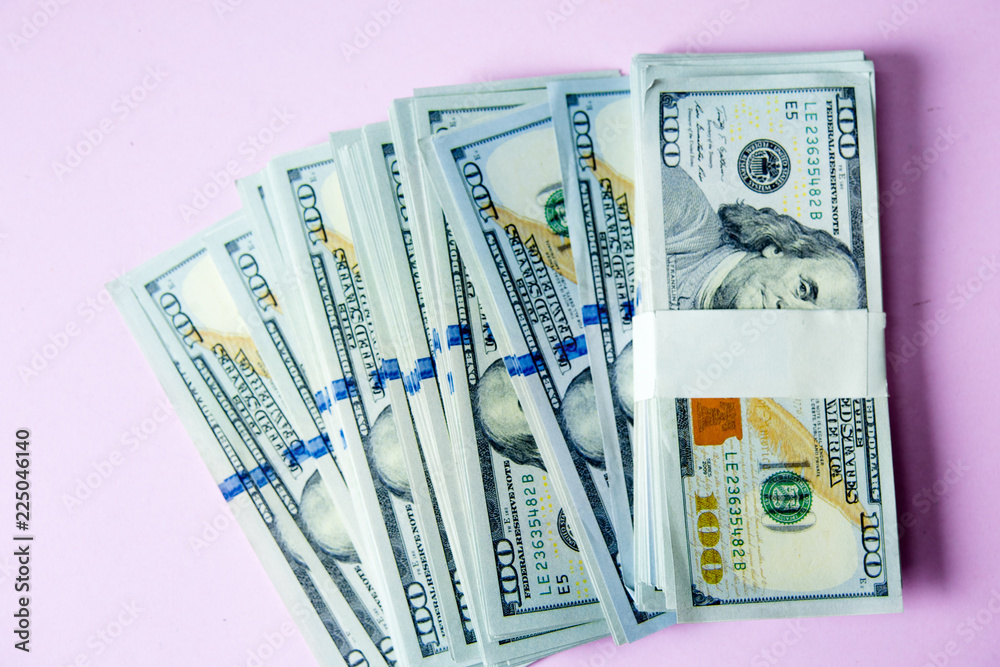 Concept of Dollar Dollars Closeup Concept One hundred dollar bills Lined up Payable taxes are legal. Concept of Dollar Dollars Closeup Concept One hundred dollar bills Lined up Payable taxes are legal.