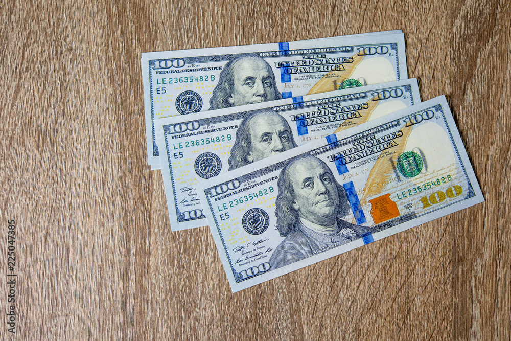 Obraz premium Concept of Dollar Dollars Closeup Concept One hundred dollar bills Lined up Payable taxes are legal.