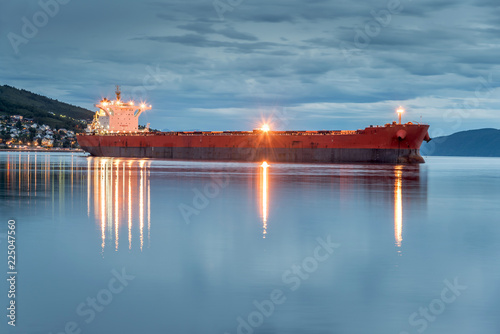 View of a cargo ship anchoring in a port of Narvik to load iron ore, Norway