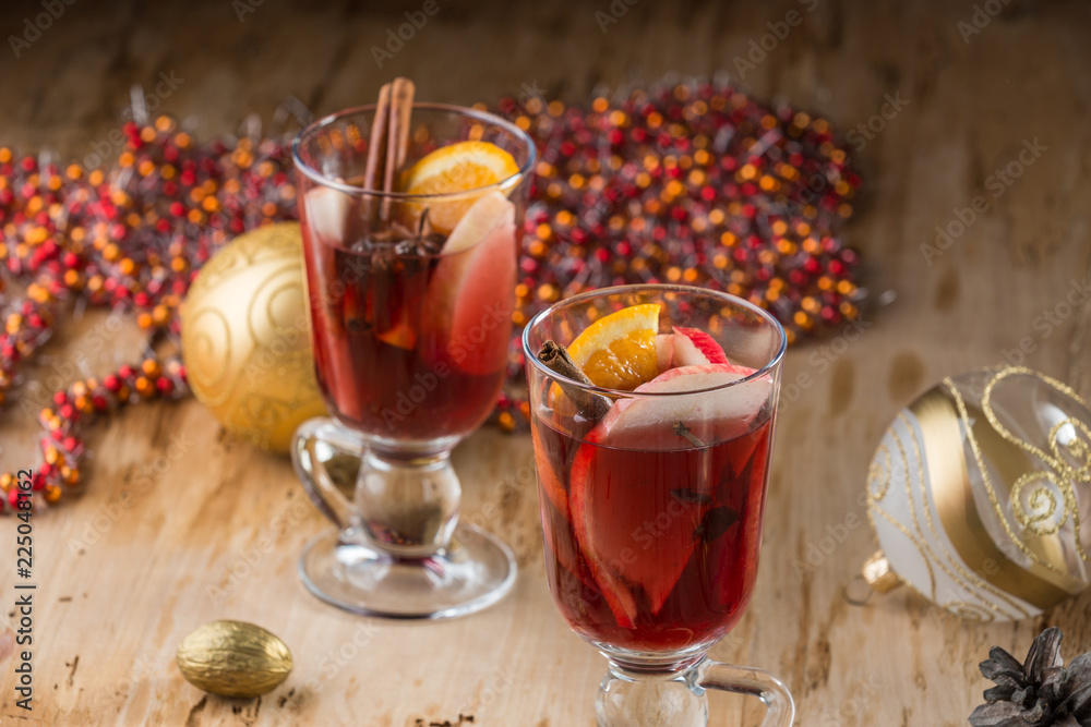 Mulled wine with nuts and spices. Selective focus. Mulled wine with nuts and spices. Selective focus.