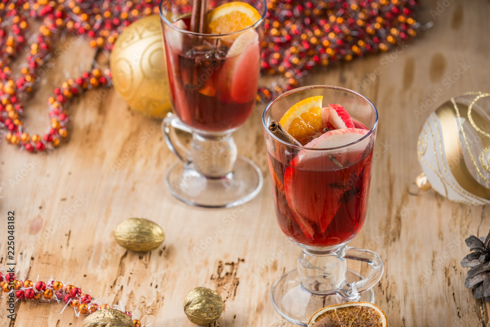 Mulled wine with nuts and spices. Selective focus. Mulled wine with nuts and spices. Selective focus.