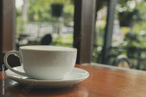 Cappuccino cup with lacquer art on wooden floor Beautiful, Ceramic Cup, Modern Color, Place for Message