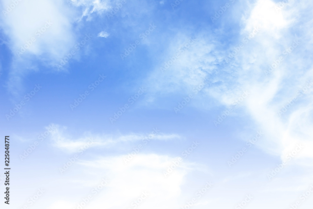 Sky background is vast with white clouds.