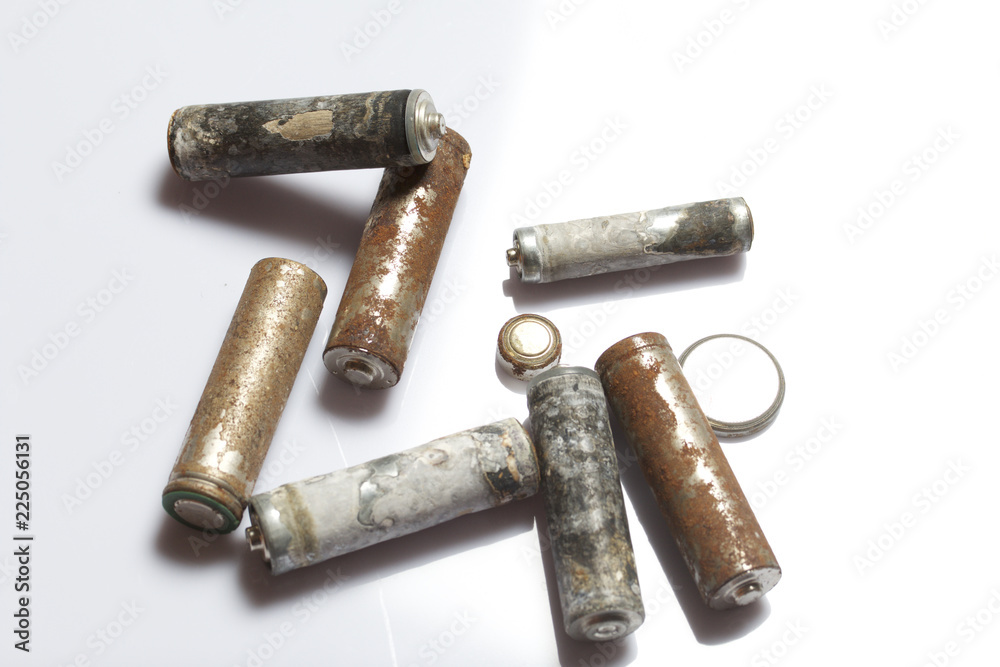 Used finger-wound batteries covered with corrosion. Recycling. Used finger-wound batteries covered with corrosion. Recycling.