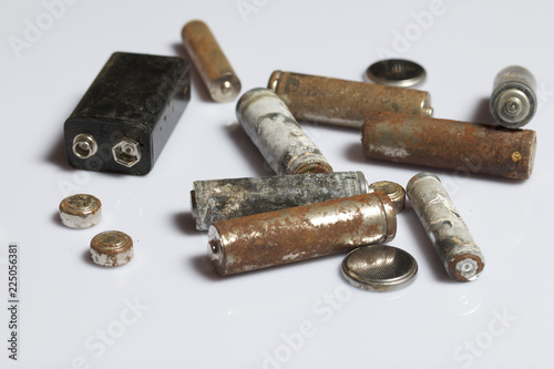 The fulfilled batteries of the different size covered with corrosion. Recycling.