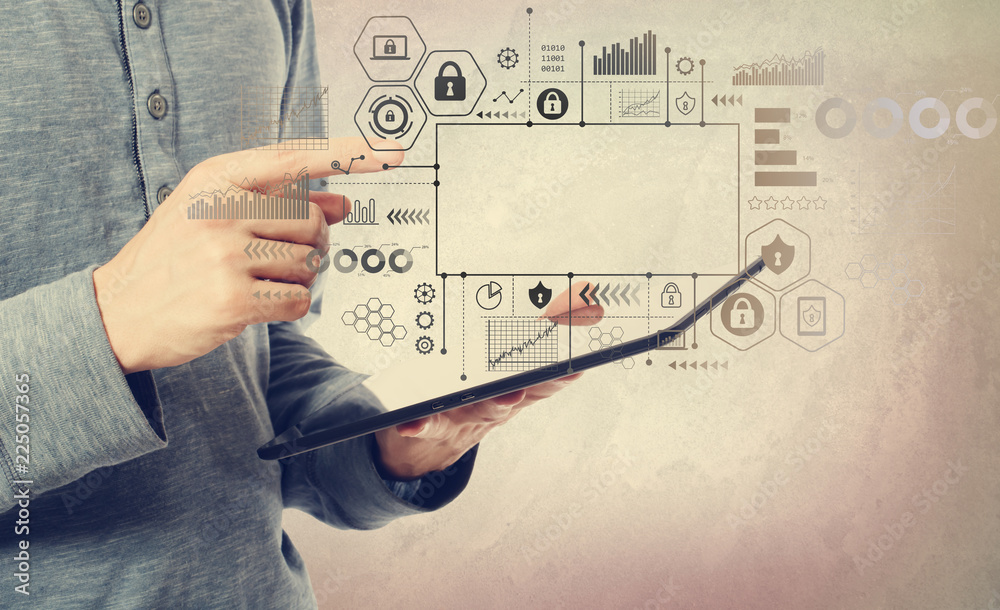 Cyber security themes with man holding a tablet computer Cyber security themes with man holding a tablet computer