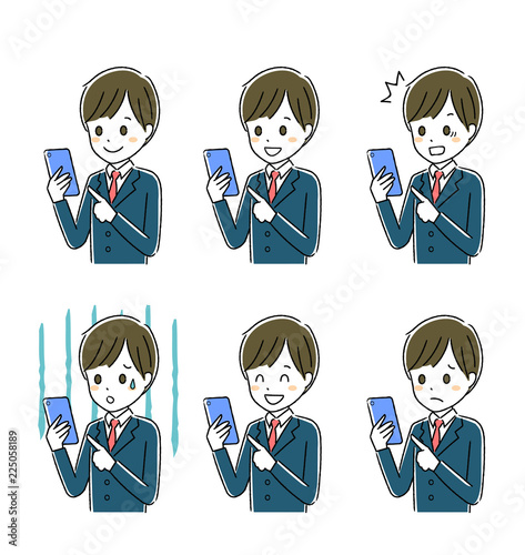 スマホを操作する男子学生