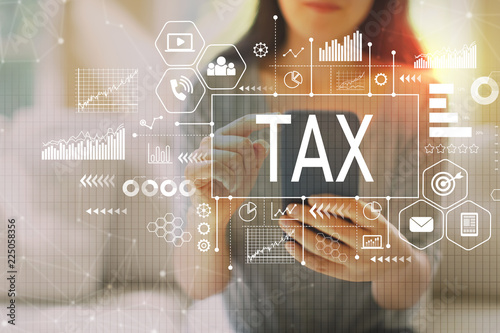 Tax with woman using her smartphone on a couch
