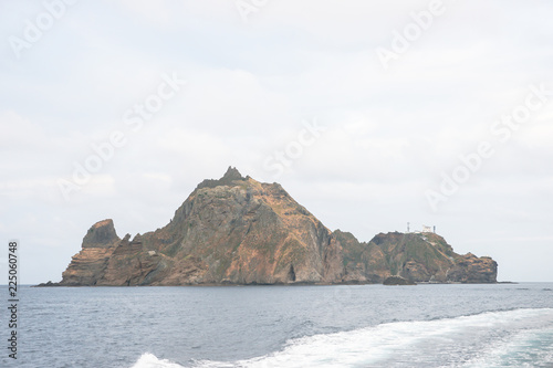 Dokdo island where is beside Ulleungdo island is one of the famous tourist site where is made by volcano. There are varous oddly formed rocks and strangely shaped stones, and clean air in the East sea © sulccojang