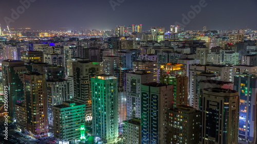 Aerial skyline of Abu Dhabi city centre from above night timelapse © neiezhmakov