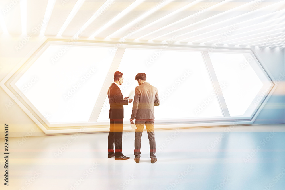 Futuristic white room, hexagonal window, people Futuristic white room, hexagonal window, people