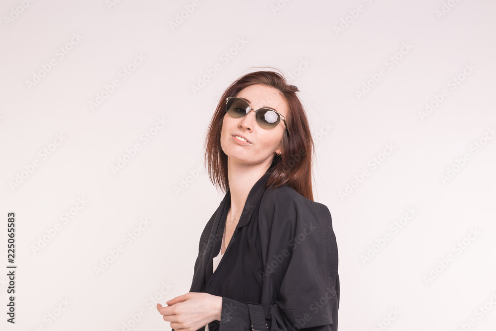 Fashion, style and people concept - happy young beautiful asian woman in sunglasses over white background Fashion, style and people concept - happy young beautiful asian woman in sunglasses over white background