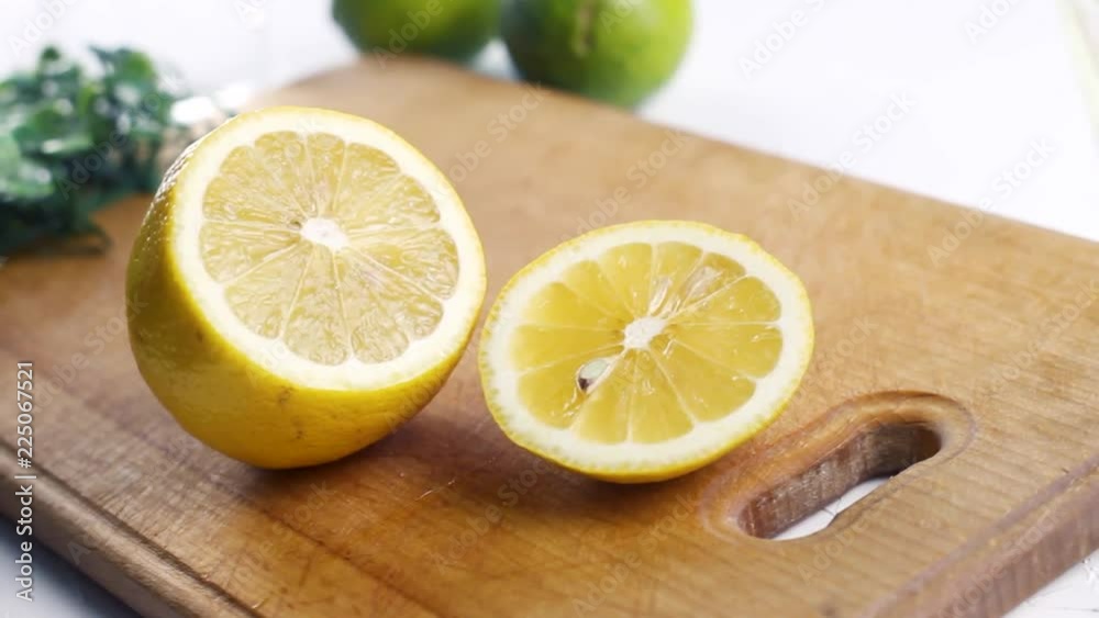 Lemon and lime on wood surface. Close up of fresh fruit. Lemon and lime on wood surface. Close up of fresh fruit.