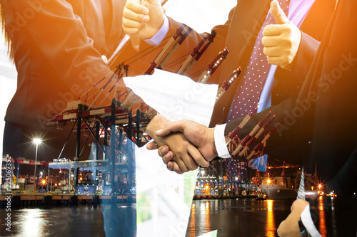Business collaboration shake hands and abstract blur transportation import export background photo