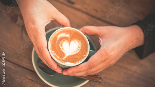 Hand Holding Hot Latte Coffee 