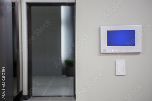 Home interior with a smart home control console or air conditioning setting - remote control touch screen