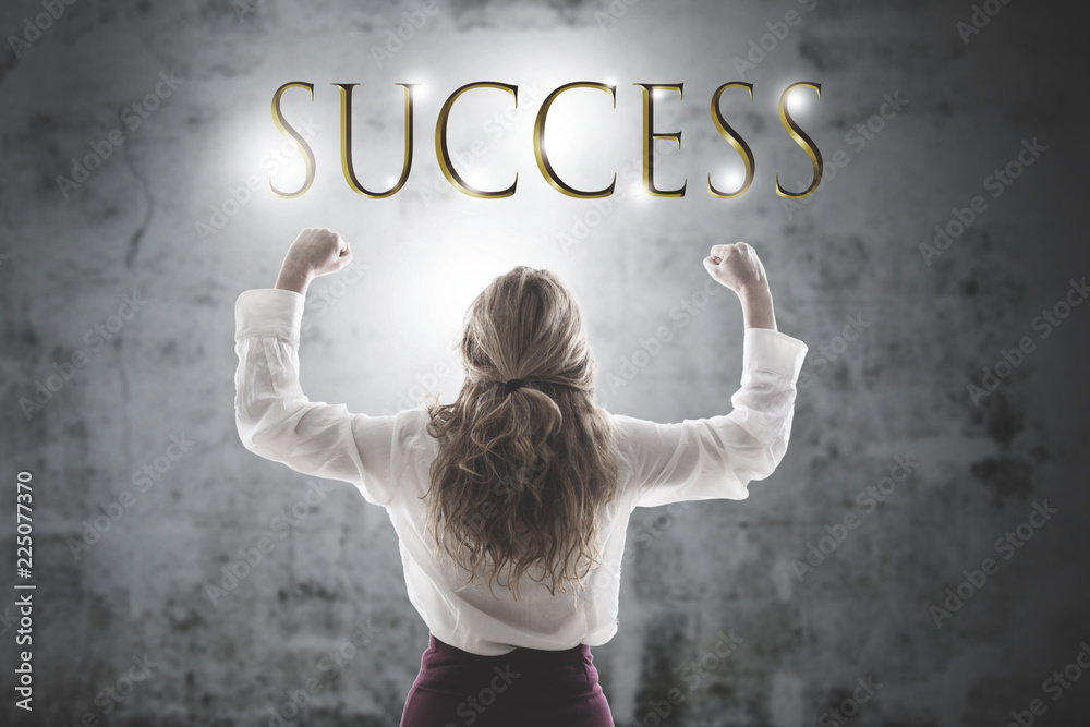 business woman with high arms and concept of success business woman with high arms and concept of success