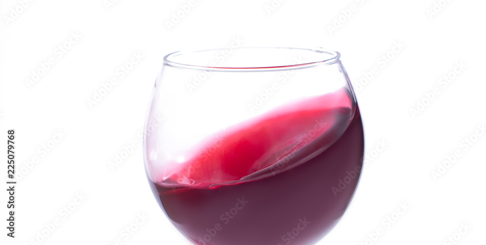 A glass with red wine on a white background. Isolate A glass with red wine on a white background. Isolate