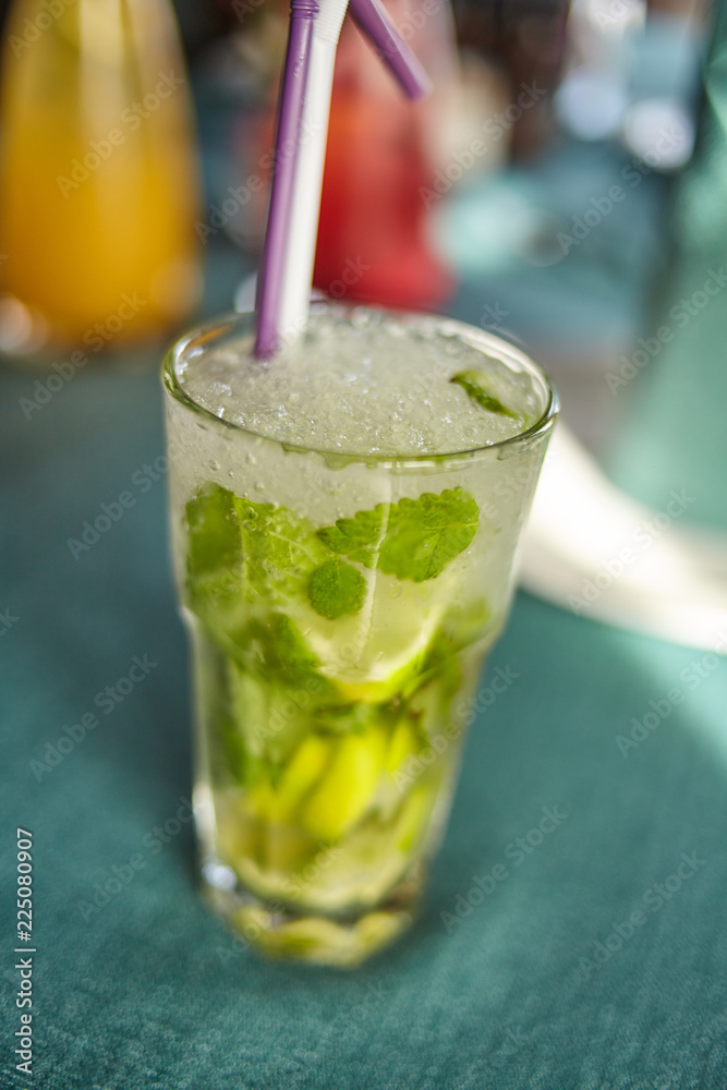 Lemonade or mojito cocktail with lemon and mint, cold refreshing drink or beverage with ice Lemonade or mojito cocktail with lemon and mint, cold refreshing drink or beverage with ice