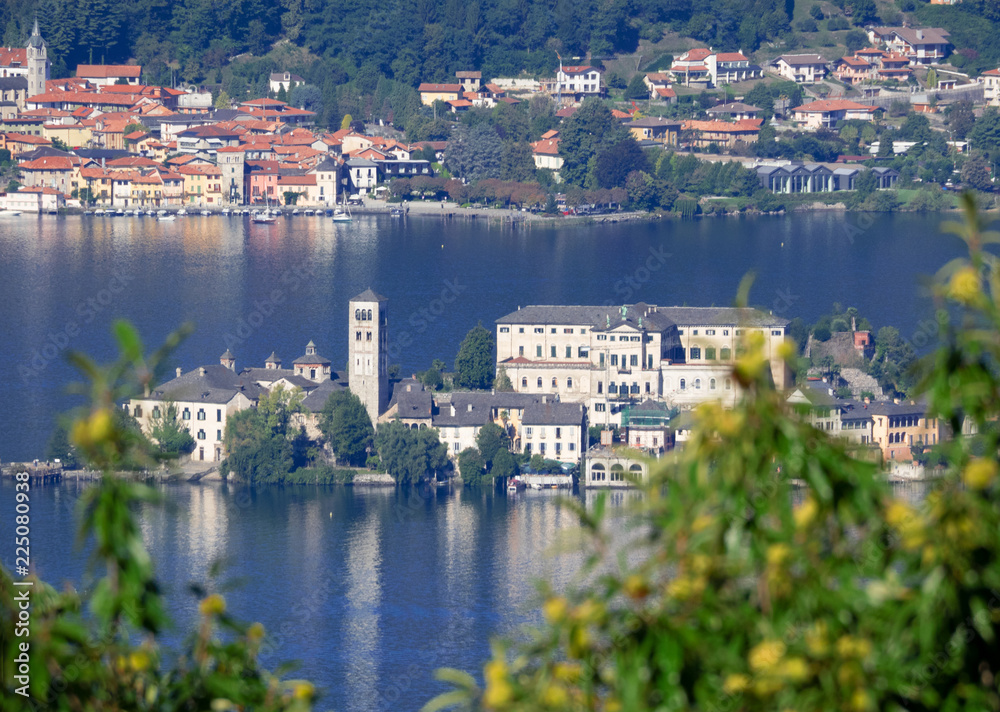 San Giulio island in autumn, seen from the nearby mountains covered with chestnut woods