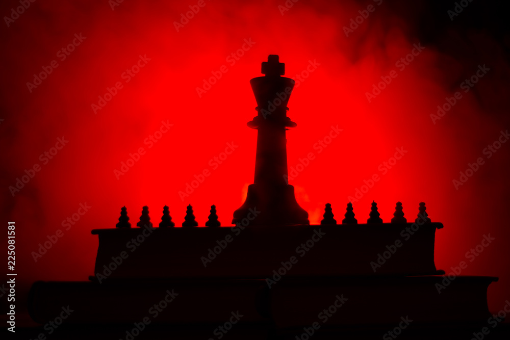 Chess board game concept of business ideas and competition or strategy ideas concept. Chess figures on a dark toned foggy background. Chess board game concept of business ideas and competition or strategy ideas concept. Chess figures on a dark toned foggy background.