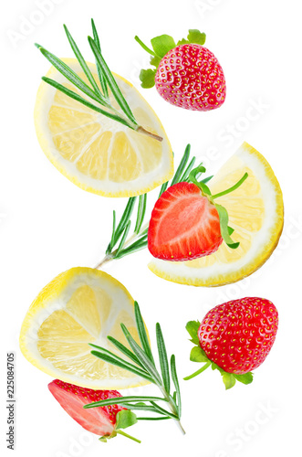 Fototapeta Naklejka Na Ścianę i Meble -  Flying Lemon slices with strawberry slices and rosemary leaves