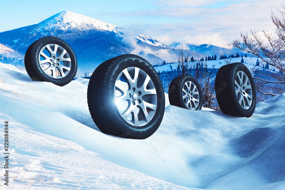 Car wheels with offroad winter tyres on snow