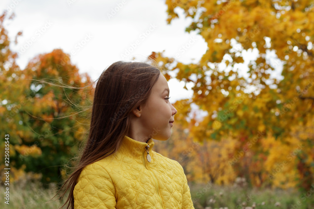 little girl model posing in autumn forest, child playing in Park little girl model posing in autumn forest, child playing in Park