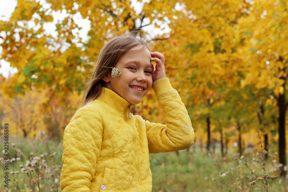 little girl model posing in autumn forest, child playing in Park little girl model posing in autumn forest, child playing in Park
