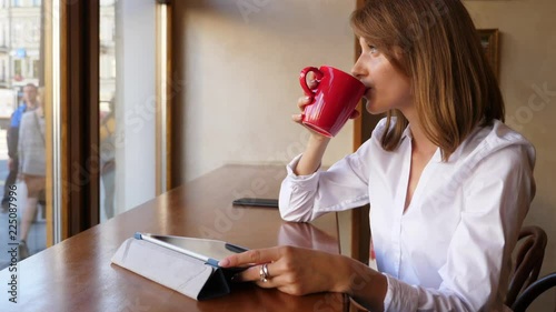 Elegant business woman drink coffee in cafe