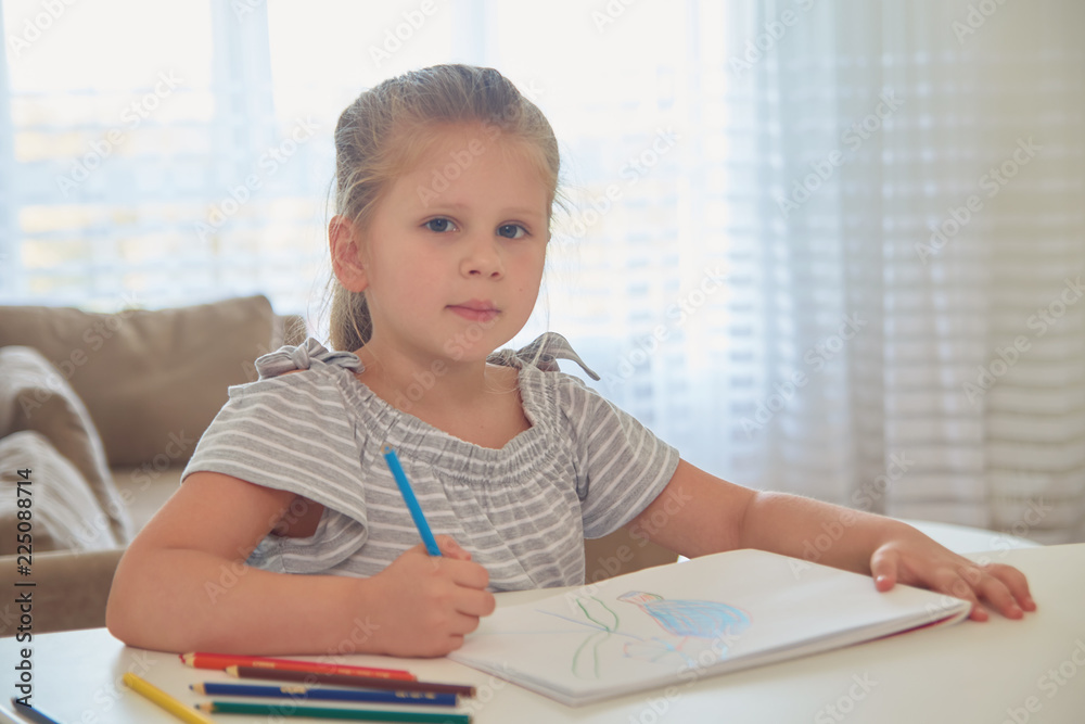 Little girl drawing with pencils at home Little girl drawing with pencils at home