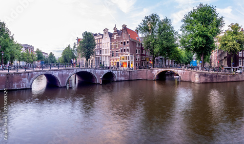 Bridge over Keizersgracht - Emperor's canal in Amsterdam, The Netherlands at twilight.