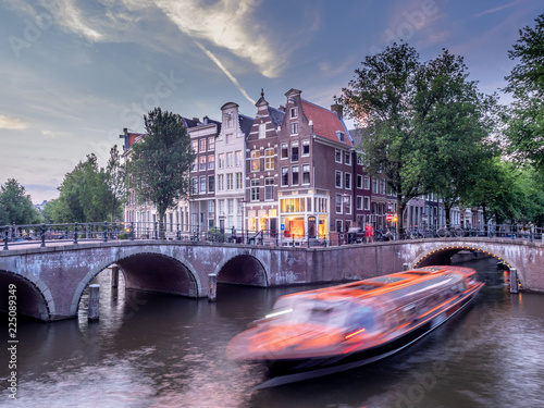 Bridge over Keizersgracht - Emperor's canal in Amsterdam, The Netherlands at twilight.