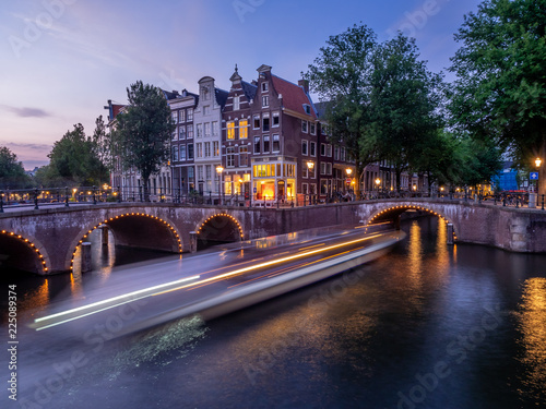 Bridge over Keizersgracht - Emperor's canal in Amsterdam, The Netherlands at twilight.