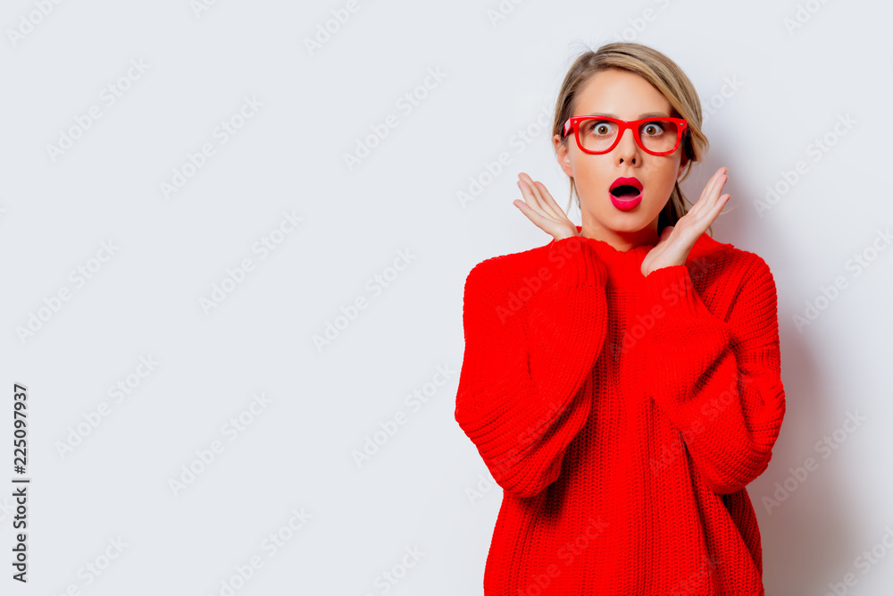 Portrait of a beautiful white woman in red sweater on white background, isolated. - obrazy, fototapety, plakaty 