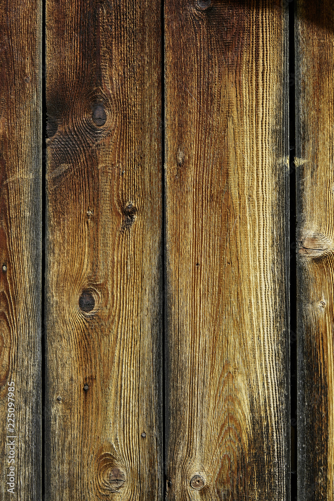Fototapeta premium Von der Sonne getönte Holzwand