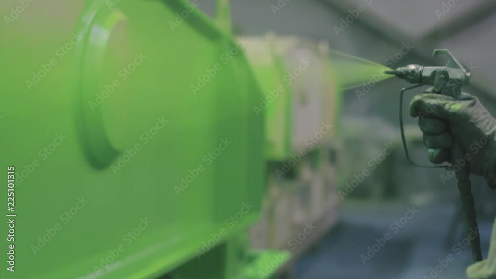 Hand painting of a metal surface by spray gun to green color Hand painting of a metal surface by spray gun to green color